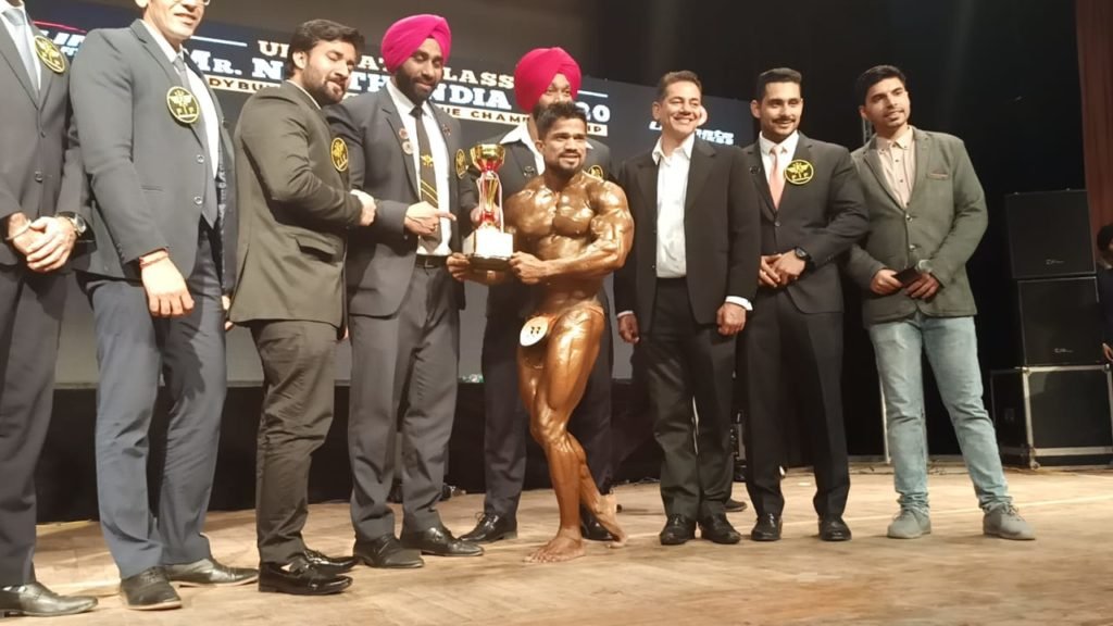 Suraj Bhan being awarded by officials and organisers after he was adjudged overall champion of Ultimate Classic Mr North India 2020 Bodybuilding & Physique Championship