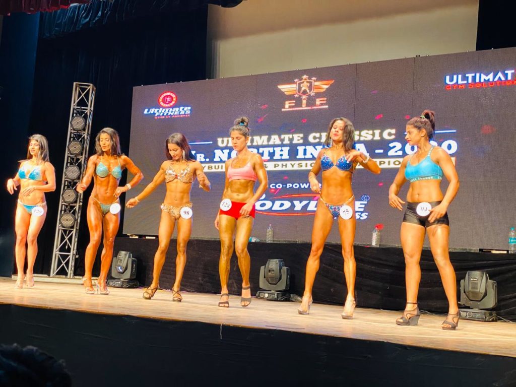 Women bodybuilders showcasing their physique at the Ultimate Classic Mr. North India 2020 championship
